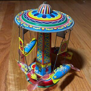 Vintage metal spinning ride toy